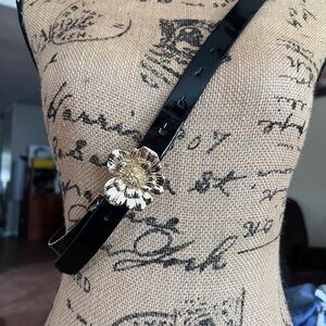 Elegant Black Belt with Gold Floral Accent